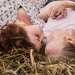 Couple facing each other on the lawn