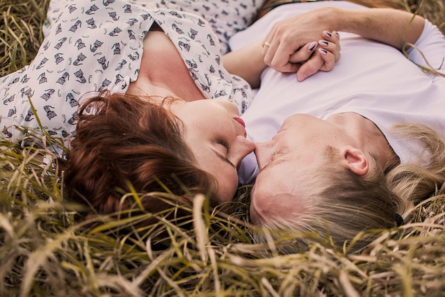 Couple facing each other on the lawn